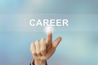 business hand pushing career button on blurred background